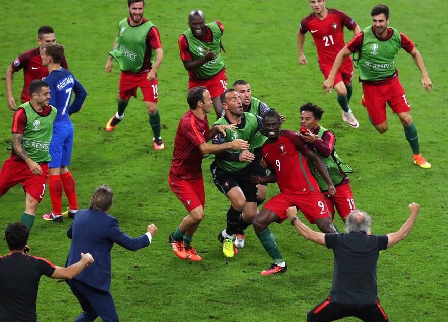 Portugal&#039;s Eder celebrates with team mates, after scoring the opening goal during the Euro 2016 final soccer match between Portugal and France at the Stade de France in Saint-Denis, north of Pari ...