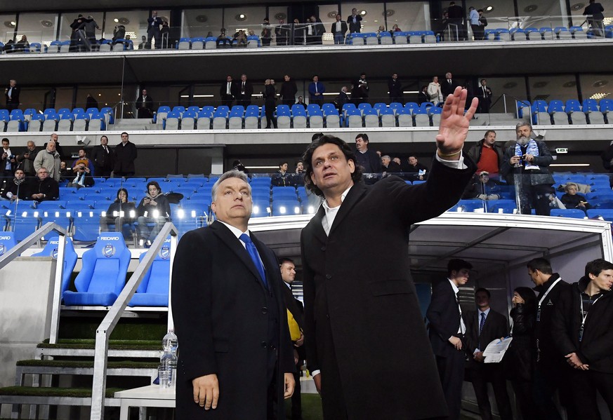 Hungarian Prime Minister Viktor Orban, left, and President of the Hungarian Soccer Club MTK Tamas Deutsch talk during the inauguration ceremony of MTK&#039;s new Hidegkuti Nandor Stadium, prior to the ...