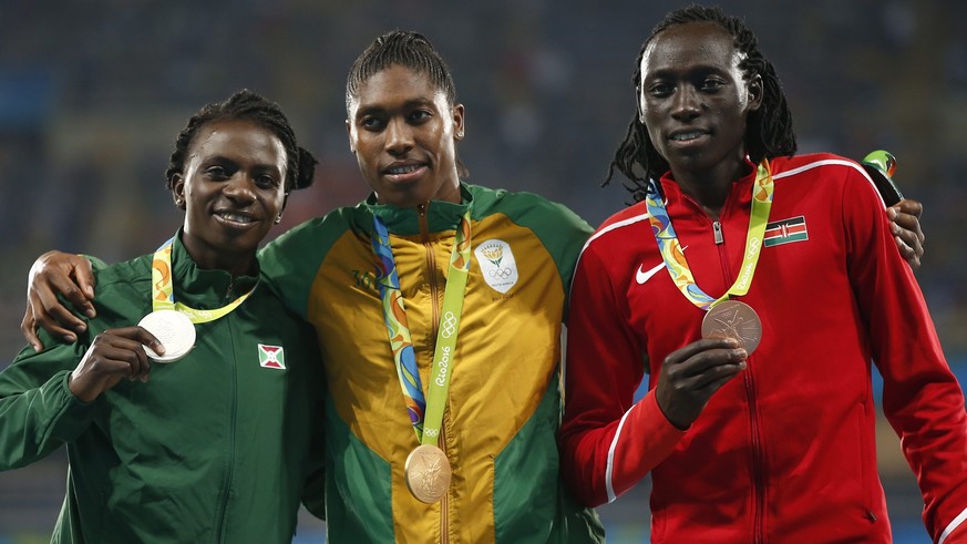epa05503936 (L-R) Silver medalist Francine Niyonsaba of Burundi, gold medalist Caster Semenya of South Africa, and bronze medalist Margaret Nyairera Wambui of Kenya pose for a photo on the podium duri ...