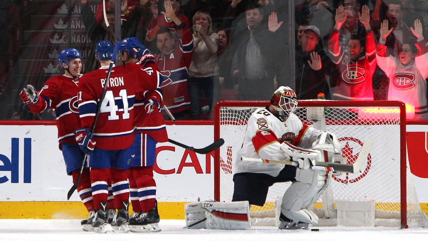 Mar 30, 2017; Montreal, Quebec, CAN; Montreal Canadiens center Tomas Plekanec (14) celebrates with teammates after scoring a goal against Florida Panthers goalie Reto Berra (20) during the first perio ...