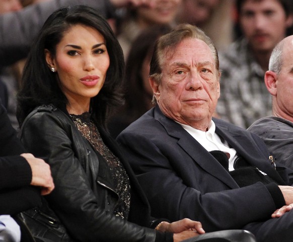 FILE - In this Dec. 19, 2010, file photo, Los Angeles Clippers owner Donald Sterling, third right, sits with V. Stiviano, left, as they watch the Clippers play the Los Angeles Lakers during an NBA pre ...