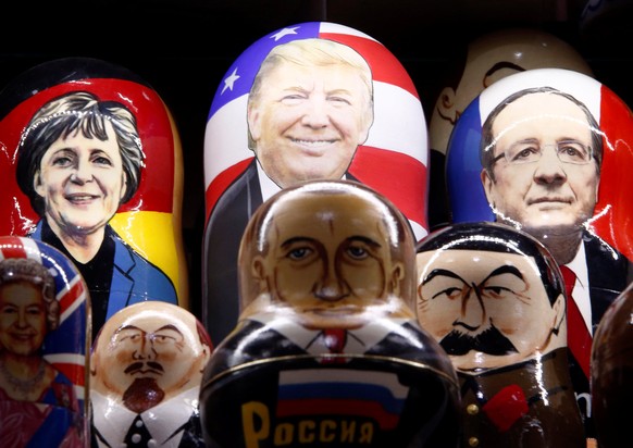 Painted Matryoshka dolls, or Russian nesting dolls, bearing the faces of German Chancellor Angela Merkel, U.S. Republican presidential nominee Donald Trump, French President Francois Hollande, Britain ...