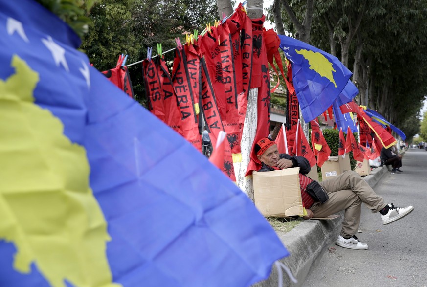 epa05572725 A street vendor wait for fans to sell Albanian and Kosovo flags and scarfs prior to the FIFA World Cup 2018 qualifying soccer match between Kosovo and Croatia in Shkoder, Albania, 06 Octob ...