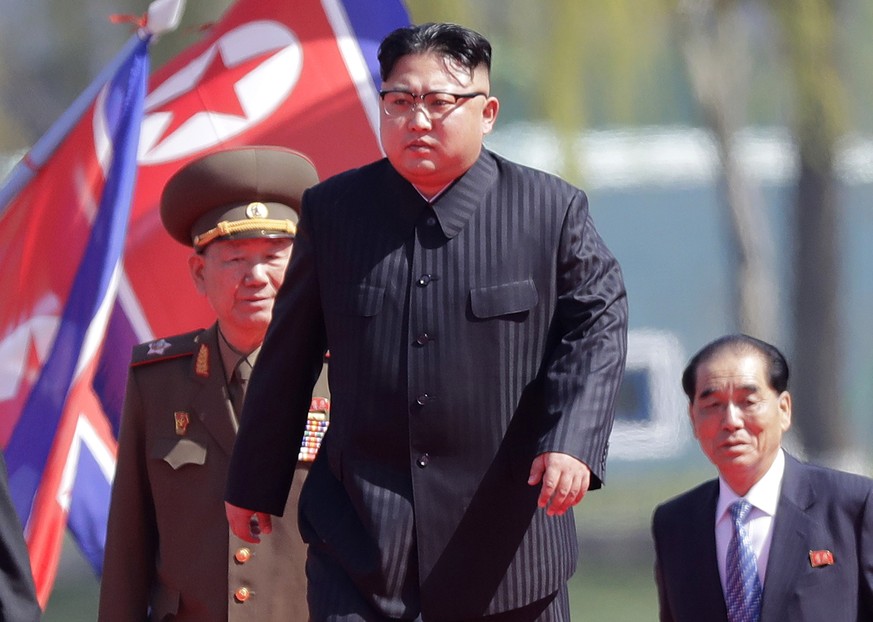 FILE - In this April 13, 2017 file photo, North Korean leader Kim Jong Un, center, is accompanied by Pak Pong Ju, right, Hwang Pyong So, second left, as he arrives for the official opening of the Ryom ...