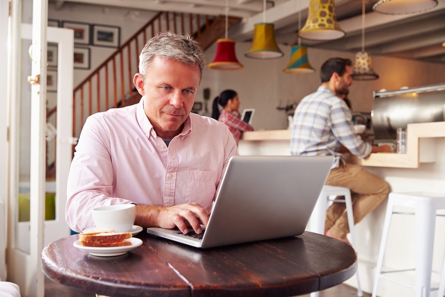 Middle-aged person working in a café