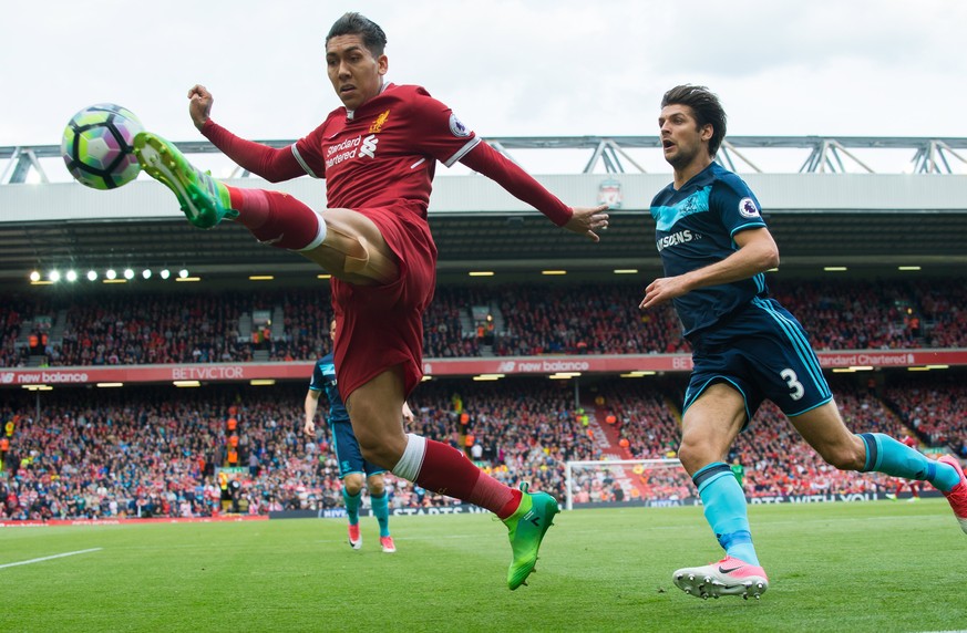 epa05978793 Liverpool’s Roberto Firmino (L) in action with Middlesbrough’s George Friend (R) during the English Premier League soccer match between Liverpool and Middlesbrough held at the Anfield in L ...