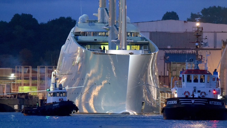 epa04942077 The sailing ship &#039;White Pearl&#039;, described by media as a &#039;Mega sailing yacht&#039;, is tugged from a port basin as it is prepared for a test voyage in Kiel, norther Germany,  ...
