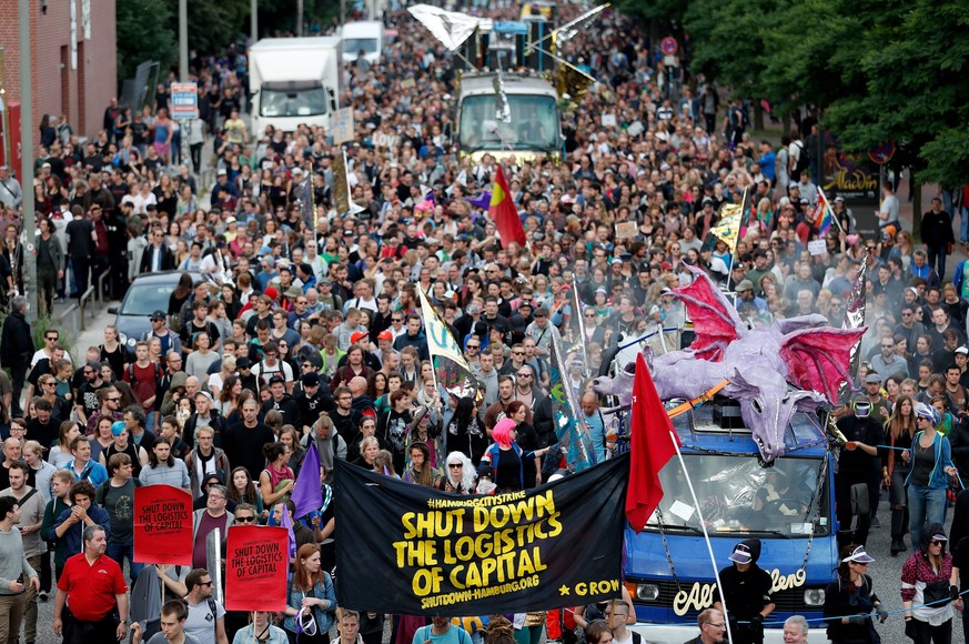 epa06068430 Protestors attend a rave demonstration prior the upcoming G20 summit in Hamburg, northern Germany, 05 July 2017. The G20 Summit (or G-20 or Group of Twenty) is an international forum for g ...