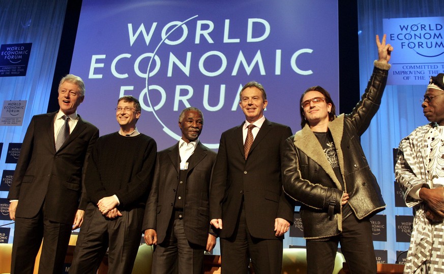 Reiche und mächtige Männer, die sich in Davos als Retter inszenieren.