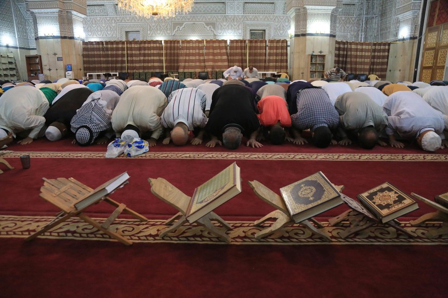 Iraqi Sunni Muslims pray on the first day of Eid al-Fitr prayers in Baghdad, Iraq, Wednesday, July. 6, 2016. Muslims worldwide are celebrating Eid al-Fitr, marking the end of the Muslim holy fasting m ...