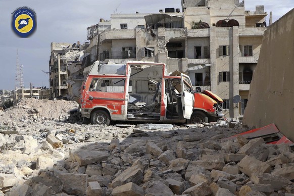 In this photo provided by the Syrian Civil Defense group known as the White Helmets, taken Sept. 23, 2016, a destroyed ambulance is seen outside the Syrian Civil Defense main center after airstrikes i ...