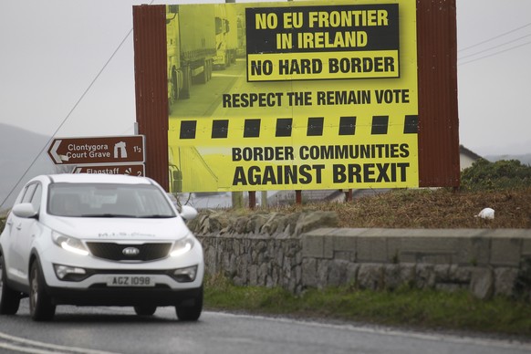 A motorist crosses over the border from the Irish Republic into Northern Ireland near the town of Jonesborough, Northern Ireland, Monday, Jan. 30, 2017. The British Prime Minister Theresa May is due t ...