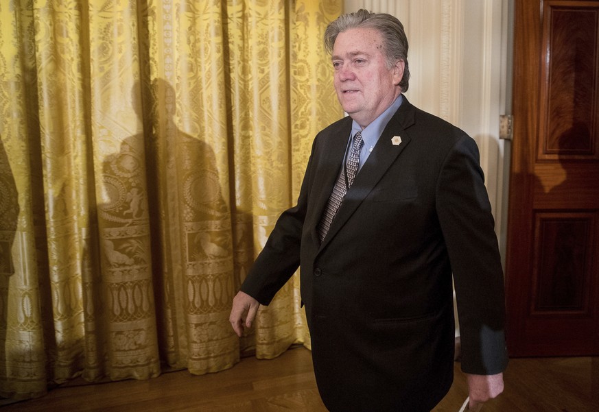 President Donald Trump&#039;s White House Senior Advisor Steve Bannon arrives at a White House senior staff swearing in ceremony in the East Room of the White House, Sunday, Jan. 22, 2017, in Washingt ...