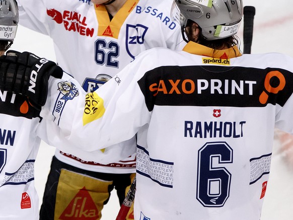 Zug&#039;s Dominic Lammer, 2nd left, celebrates his goal with Zug&#039;s Pierre-Marc Bouchard, of Canada, left, Robin Grossmann #77, Jarkko Immonen #62, of Finland, and Tim Ramholt, right, after score ...