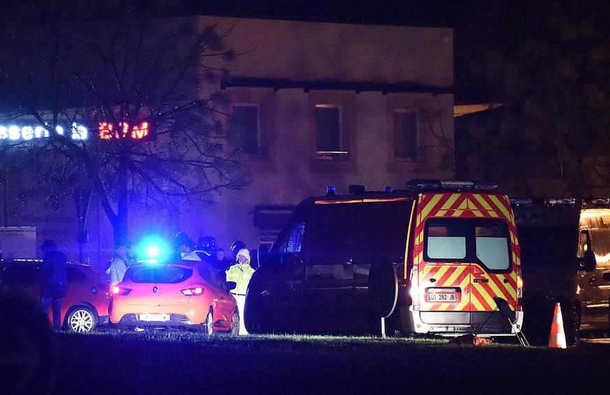 epa05646343 Rescue members stand guard along a security area near a retirement home for Catholic missionaries in Montferrier sur lez, near Montpellier, Southern France, 25 November 2016. According to  ...