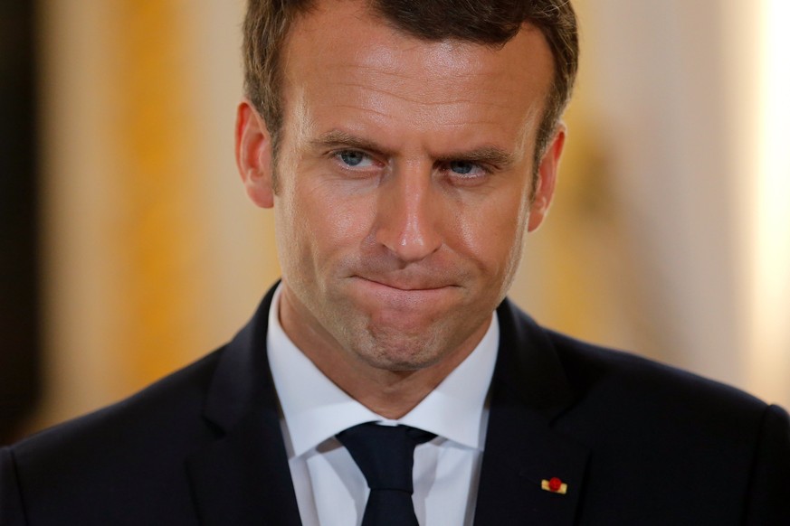 epa06091273 French President Emmanuel Macron reacts during a joint press conference with Israeli Prime Minister Benjamin Netanyahu (npt pictured) at the Elysee Palace in Paris, France, 16 July 2017. M ...