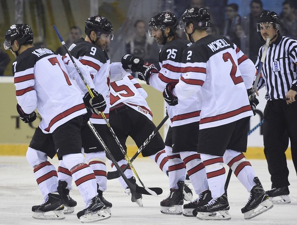 Canada&#039;s Derek Roy, no. 9, and Maxime Talbot, no. 25, touch gloves after their team scored against Hungary during their friendly match in Budapest, Hungary, Tuesday, Nov. 1, 2016. The match is th ...