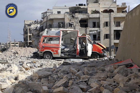 FILE - In this photo provided by the Syrian Civil Defense group known as the White Helmets, taken Sept. 23, 2016, a destroyed ambulance is seen outside the Syrian Civil Defense main center after airst ...