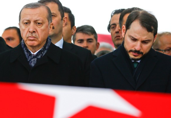Turkish President Tayyip Erdogan, accompanied by Energy Minister Berat Albayrak, attends a funeral ceremony for police officer Hasim Usta who was killed in Saturday&#039;s blasts, in Istanbul, Turkey, ...