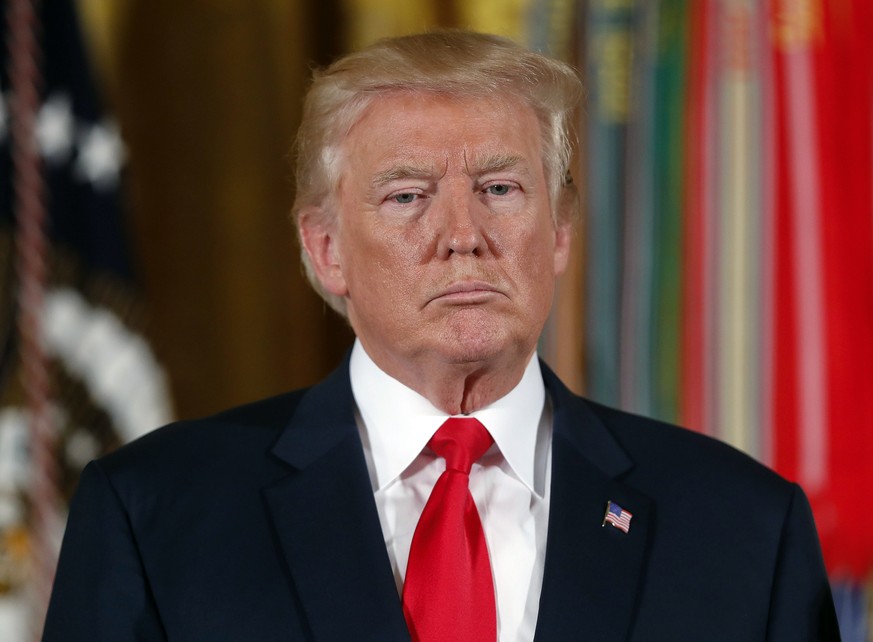 President Donald Trump waits to bestow the nation&#039;s highest military honor, the Medal of Honor to retired Army medic James McCloughan during a ceremony in the East Room of the White House in Wash ...