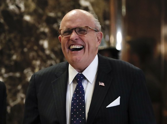 Former New York Mayor Rudy Giuliani laughs as he arrives at Trump Tower, Wednesday, Nov. 16, 2016, in New York. (AP Photo/Carolyn Kaster)