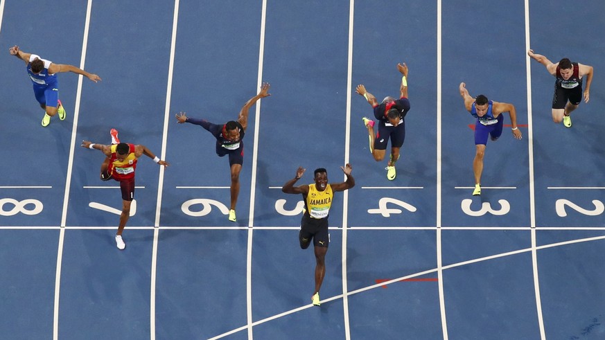 2016 Rio Olympics - Athletics - Final - Men&#039;s 110m Hurdles Final - Olympic Stadium - Rio de Janeiro, Brazil - 16/08/2016. Omar McLeod (JAM) of Jamaica reacts as he crosses the finish line first t ...