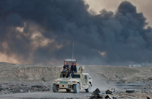 An Iraqi army vehicle is seen during an operation to attack Islamic State militants in Mosul, in Qayyara, Iraq, October 22, 2016. REUTERS/Alaa Al-Marjani