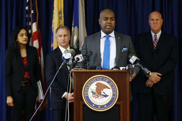 Newark Mayor Ras Baraka, front, stands with Vanita Gupta, left, principal deputy assistant attorney general for the U.S. Department of Justice Civil Rights Division, Paul Fishman, second from left, U. ...