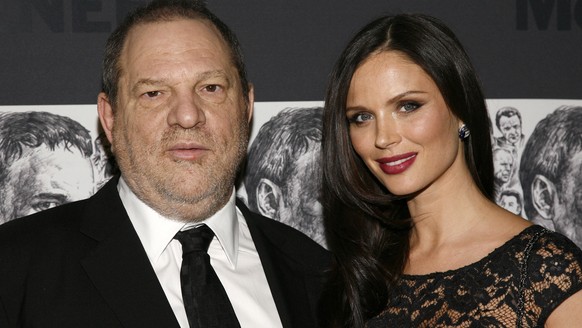 FILE - In this Dec. 3, 2012 file photo, producer Harvey Weinstein, left, and his wife, fashion designer Georgina Chapman attend the Museum of Modern Art Film Benefit Tribute to Quentin Tarantino in Ne ...