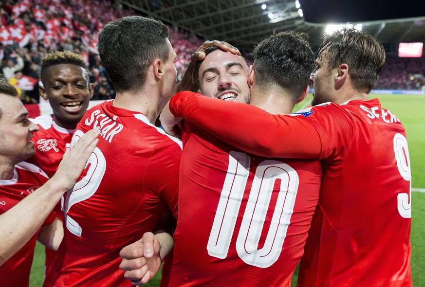 epa05870502 Swiss forward Josip Drmic (C) celebrates scoring the opening goal during the 2018 Fifa World Cup Russia group B qualification soccer match between Switzerland and Latvia, at the stade de G ...