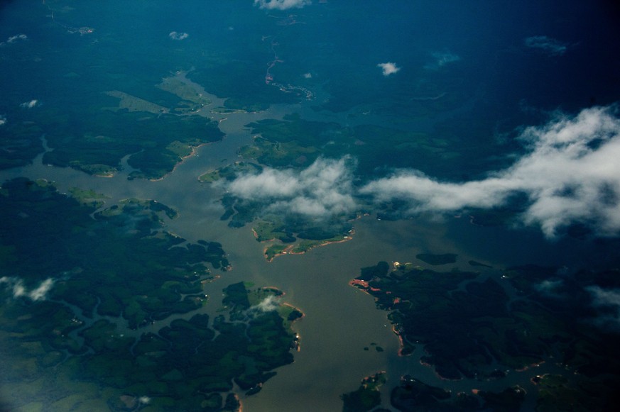 (FILES) Aerial view of the Amazon river, Amazonas state, Brazil on December 12, 2013. Police in Brazil have broken up an Amazon deforestation gang considered the worst currently active, officials said ...
