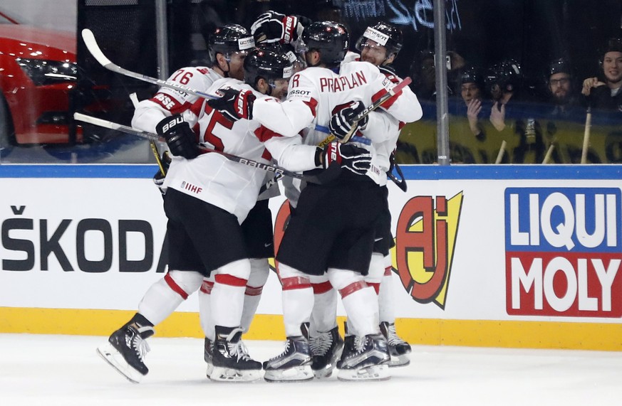 epa05962209 Players of Switzerland celebrate a goal during the IIHF Ice Hockey World Championship 2017 group B preliminary round game between Canada and Switzerland, in Paris, France, 13 May 2017. EPA ...