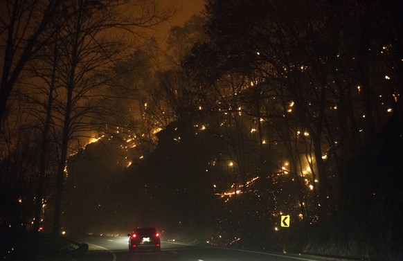 Fire erupts on both side of Highway 441 between Gatlinburg and Pigeon Forge, Tenn., Monday, Nov. 28, 2016. In Gatlinburg, smoke and fire caused the mandatory evacuation of downtown and surrounding are ...