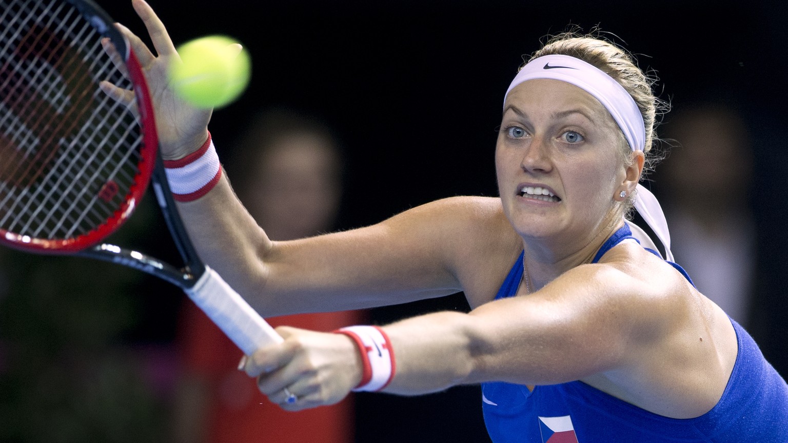 FILE - In this Nov. 12, 2016 file picture Czech Republic&#039;s Petra Kvitova returns the ball to France&#039;s Caroline Garcia during the Fed Cup final in Strasbourg, eastern France. Two-time Wimbled ...