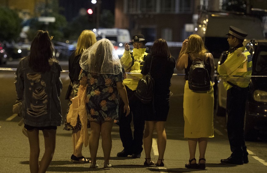 epa06009247 Police officers redirect members of the public after reports of a incident involving a van hitting pedestrians on London Bridge and stabbings and shootings in Borough Market, Central Londo ...