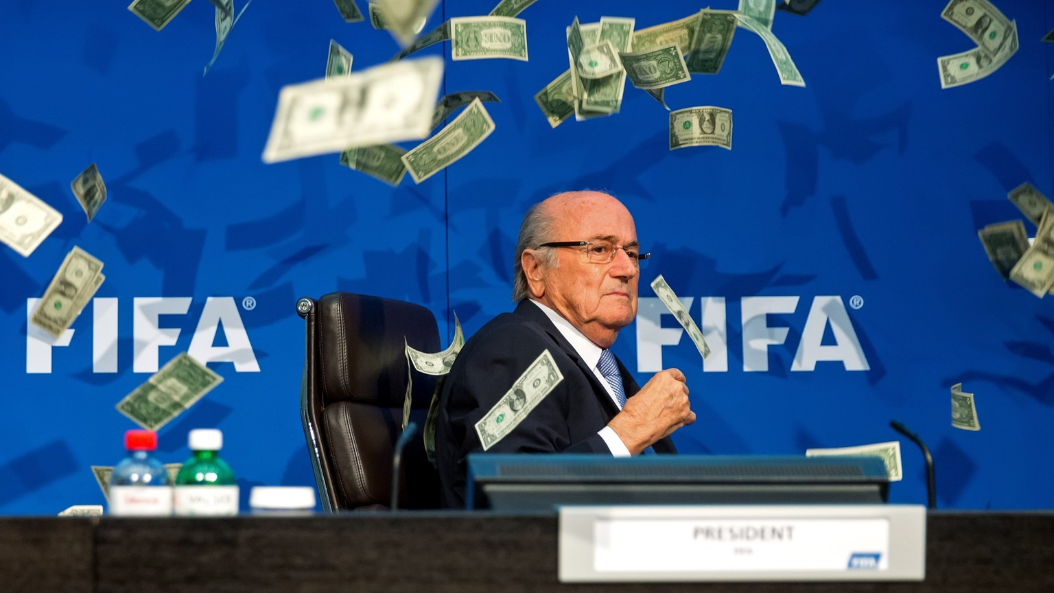 ZURICH, SWITZERLAND - JULY 20: A comedian attacked FIFA President Joseph S. Blatter with money during a press conference at the Extraordinary FIFA Executive Committee Meeting at the FIFA headquarters  ...