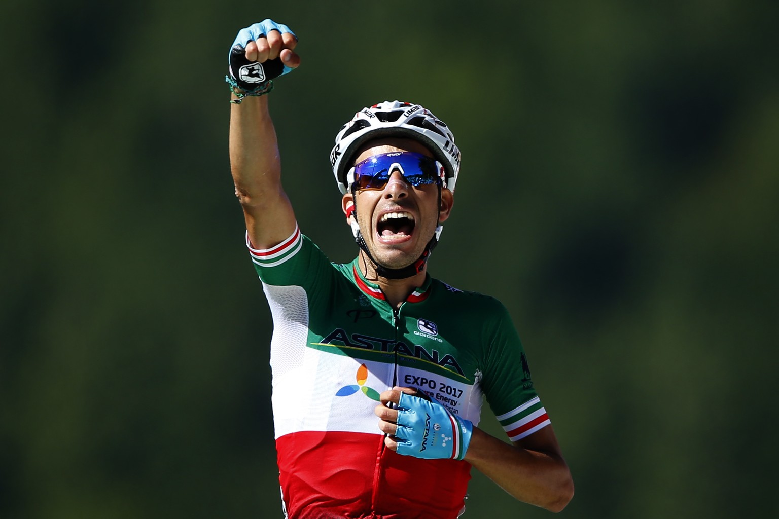 Italy&#039;s Fabio Aru celebrates as he crosses the finish line to win the fifth stage of the Tour de France cycling race over 160.5 kilometers (99.7 miles) with start in Vittel and finish in La Planc ...