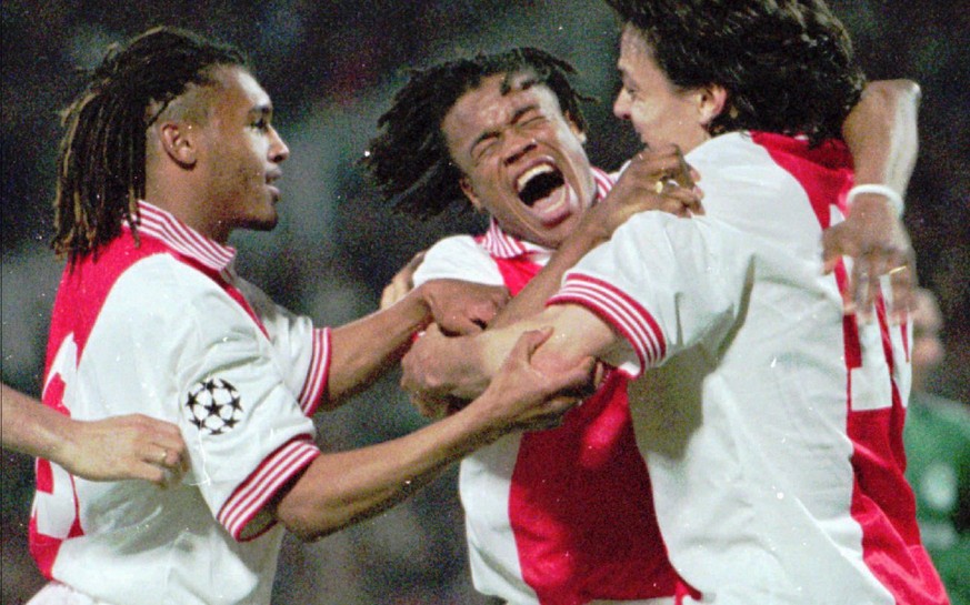 Ajax players,from left,Kiki Musampa,Edgar Davids and Jaril Litmanen celebrate after scoring the decider during the semi-final match for Champions League against Panathinaikos in Athens Wednesday April ...