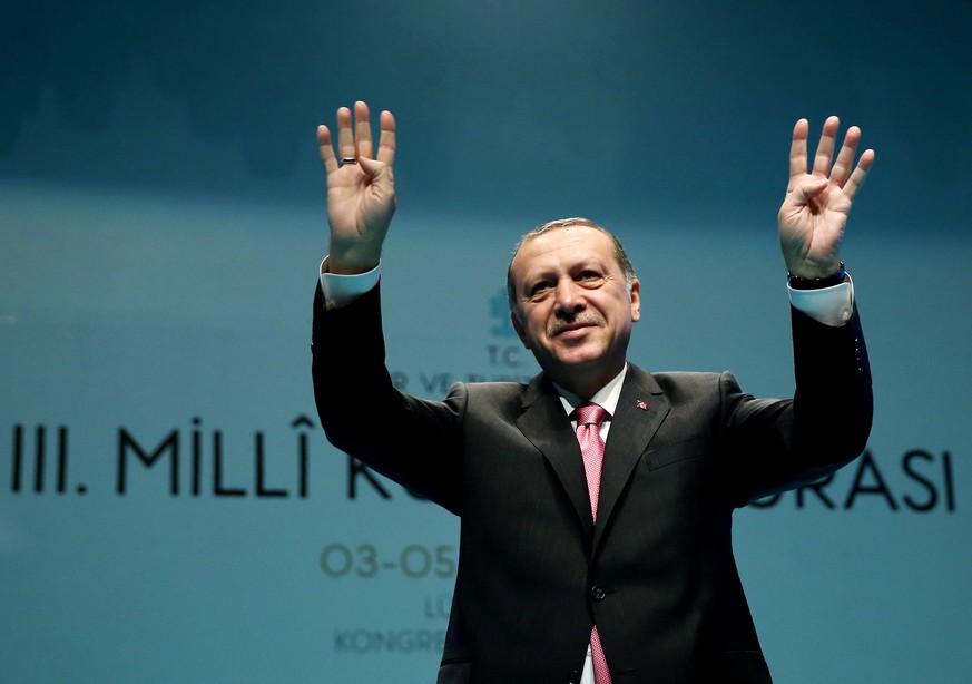 Turkish President Tayyip Erdogan greets the audience during a conference in Istanbul, Turkey, March 3, 2017. Yasin Bulbul/Presidential Palace/Handout via REUTERS ATTENTION EDITORS - THIS PICTURE WAS P ...