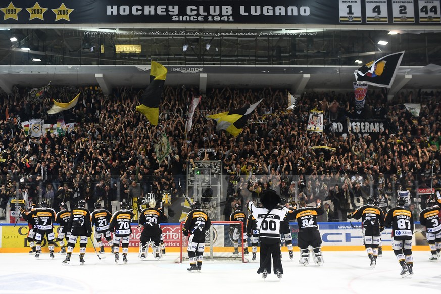 Lugano’s players celebrate victory with Curva Nord fans at the end of the sixth leg of the Playoffs quarterfinals game of National League A (NLA) Swiss Championship between Switzerland&#039;s HC Lugan ...