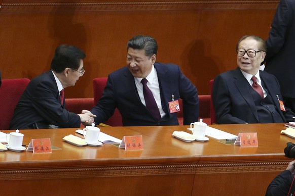 epa06272476 Chinese President and General Secretary of the Communist Party of China Xi Jinping (C) shakes hands with former Chinese President Hu Jintao (L) beside former Chinese President Jiang Zemin  ...