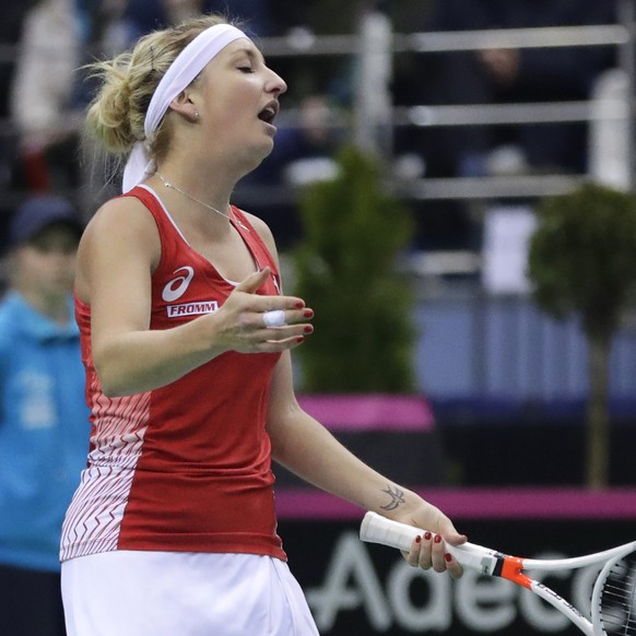 Timea Bacsinszky, of Switzerland, reacts after missing a point against Aliaksandra Sasnovich, of Belarus, during the Fed Cup World Group semi final tennis match between Belarus and Switzerland, in Min ...