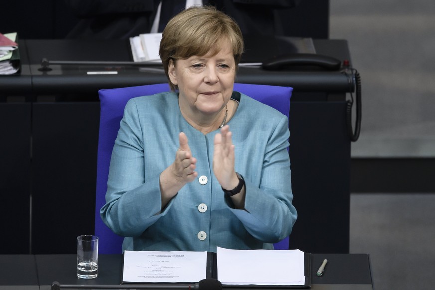 epa06055420 German Chancellor Angela Merkel applauds prior to her speech to the German Bundestag in Berlin, Germany, 29 July 2017. Merkel in her government declaration outlined the German strategy for ...