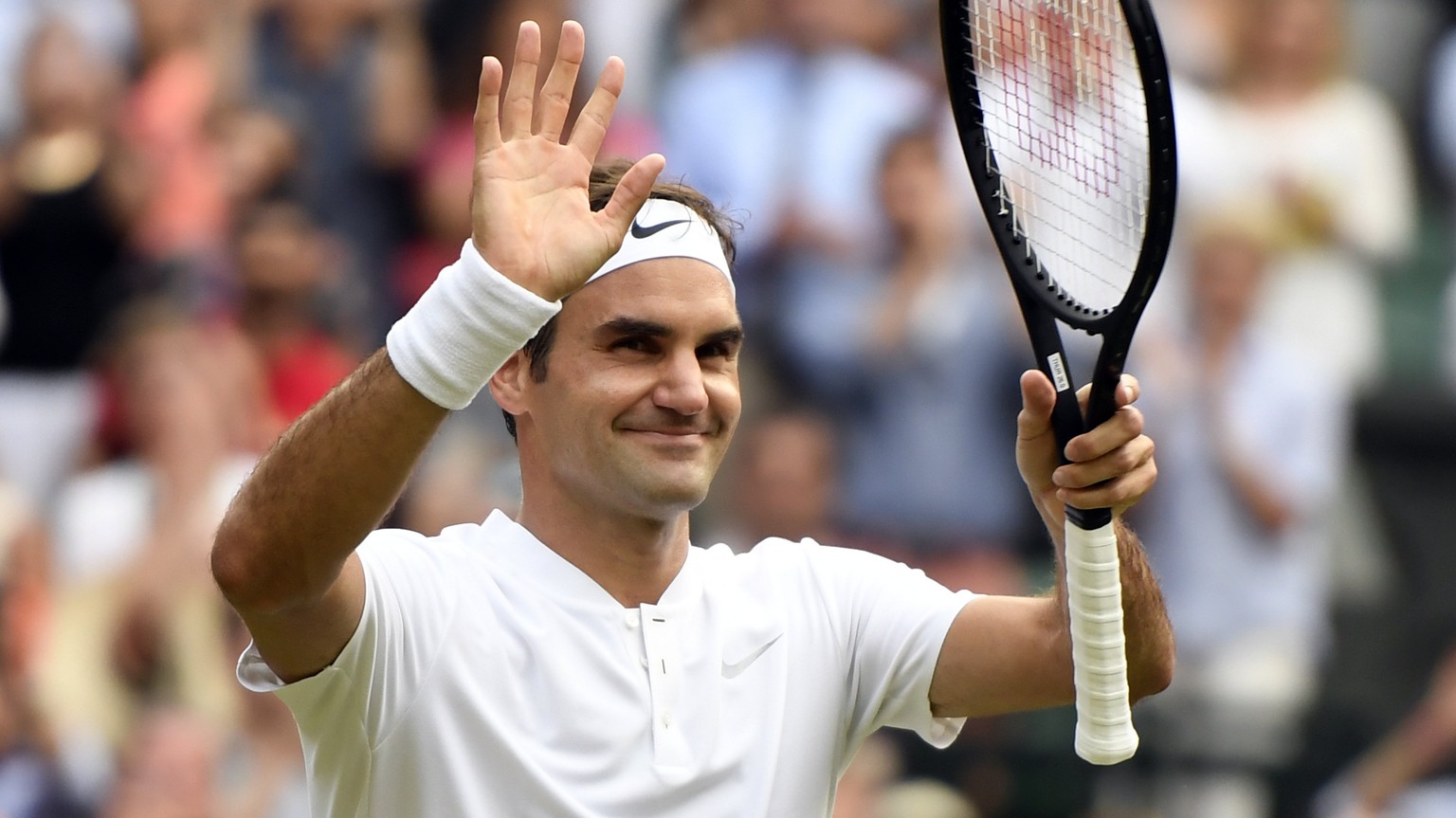 epa06071215 Roger Federer of Switzerland celebrates his win over Dusan Lajovic of Serbia in their second round match during the Wimbledon Championships at the All England Lawn Tennis Club, in London,  ...