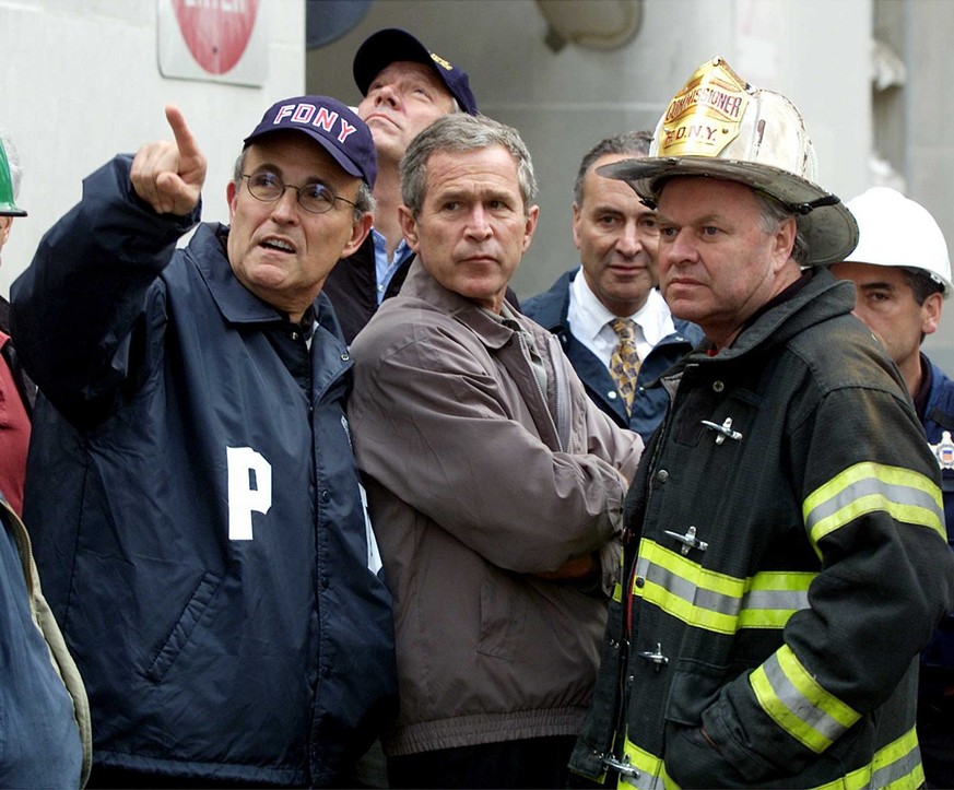 President Bush, center, New York City Mayor Rudolph Giuliani, left, and New York Governor George Pataki, second from left, Sen. c, D-N.Y., second from right, and New York City Fire Commissioner Thomas ...