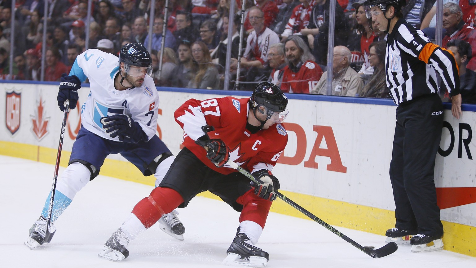 Sep 27, 2016; Toronto, Ontario, Canada; Team Canada center Sidney Crosby (87) battles for the puck with Team Europe defenseman Mark Streit (7) during the third period in game one of the World Cup of H ...