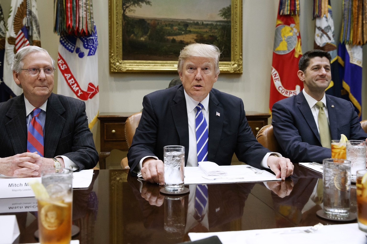President Donald Trump, flanked by Senate Majority Leader Mitch McConnell of Ky. and House Speaker Paul Ryan of Wis., hosts a meeting with House and Senate leadership, Wednesday, March 1, 2017, in the ...