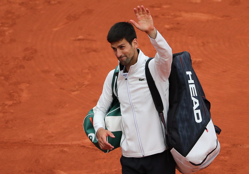 epa06014639 Novak Djokovic of Serbia reacts after losing against Dominic Thiem of Austria during their men’s singles quarter final match during the French Open tennis tournament at Roland Garros in Pa ...