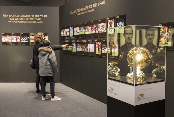 epa05088417 Visitors watch the temporary exhibition &#039;Fifa Ballon d&#039;Or&#039; at the FIFA Museum in Zurich, Switzerland, 05 January 2016. The new FIFA museum will open its doors in the first q ...