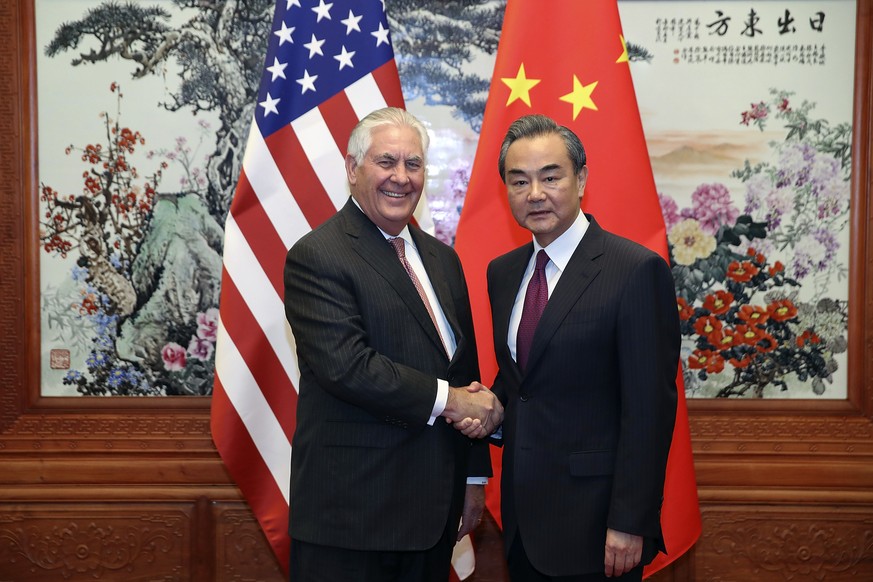 U.S. Secretary of State Rex Tillerson, left, shakes hands with Chinese Foreign Minister Wang Yi before their meeting at the Great Hall of the People in Beijing Saturday, Sept. 30, 2017. (Lintao Zhang/ ...